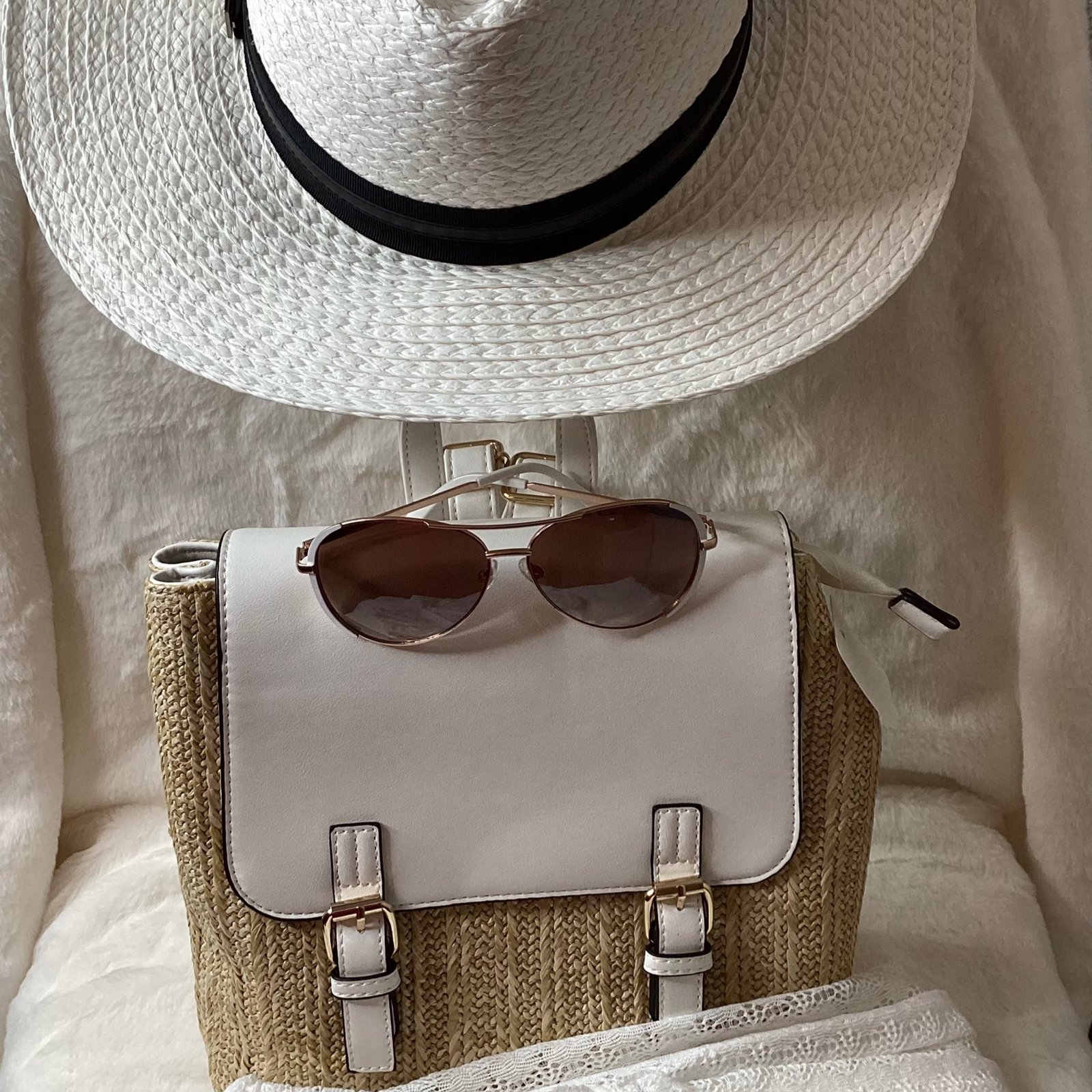 White beach pants with backpack and sunglasses